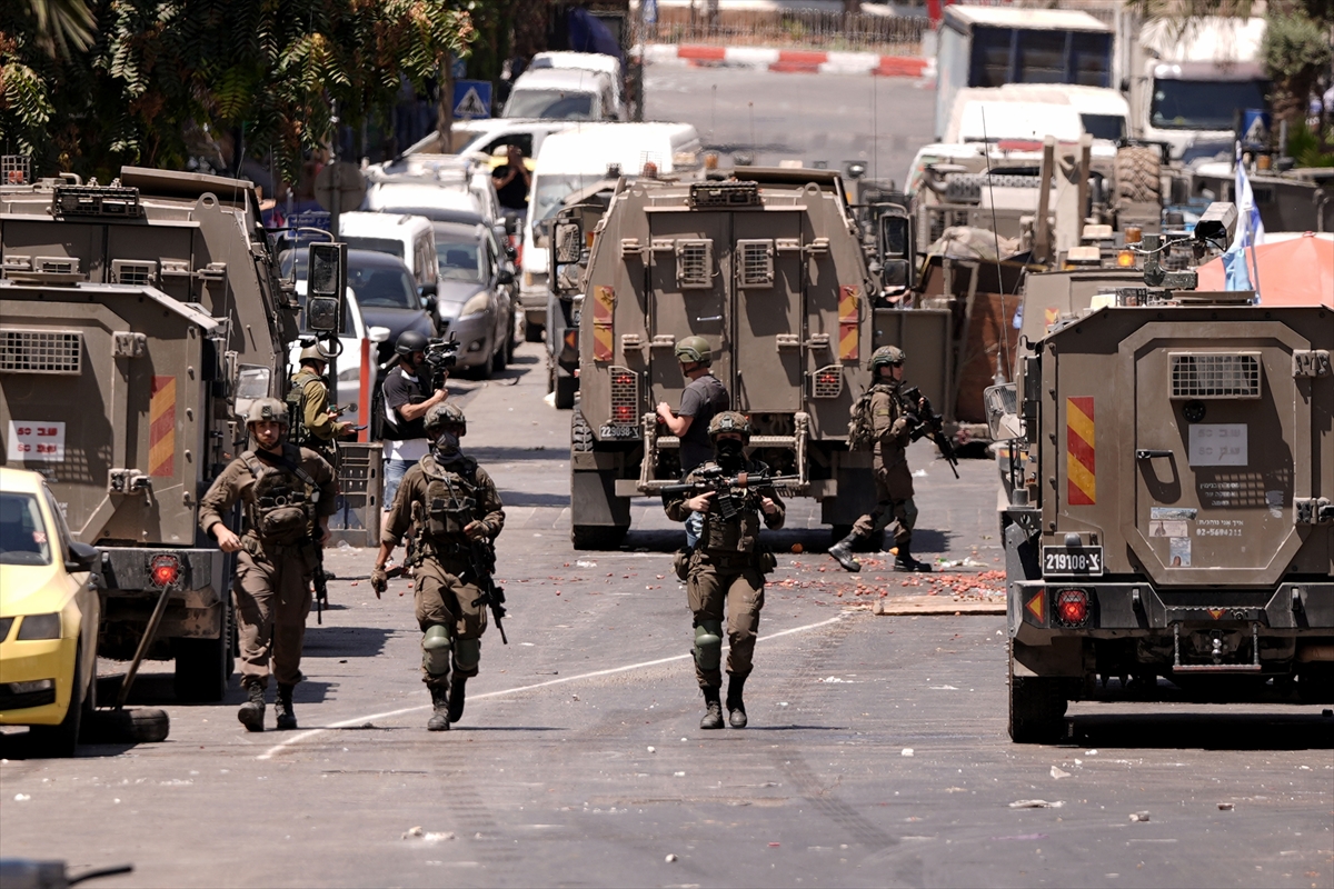 At least 57 killed and dozens injured as Israeli strikes pound Gaza homes and aid queues