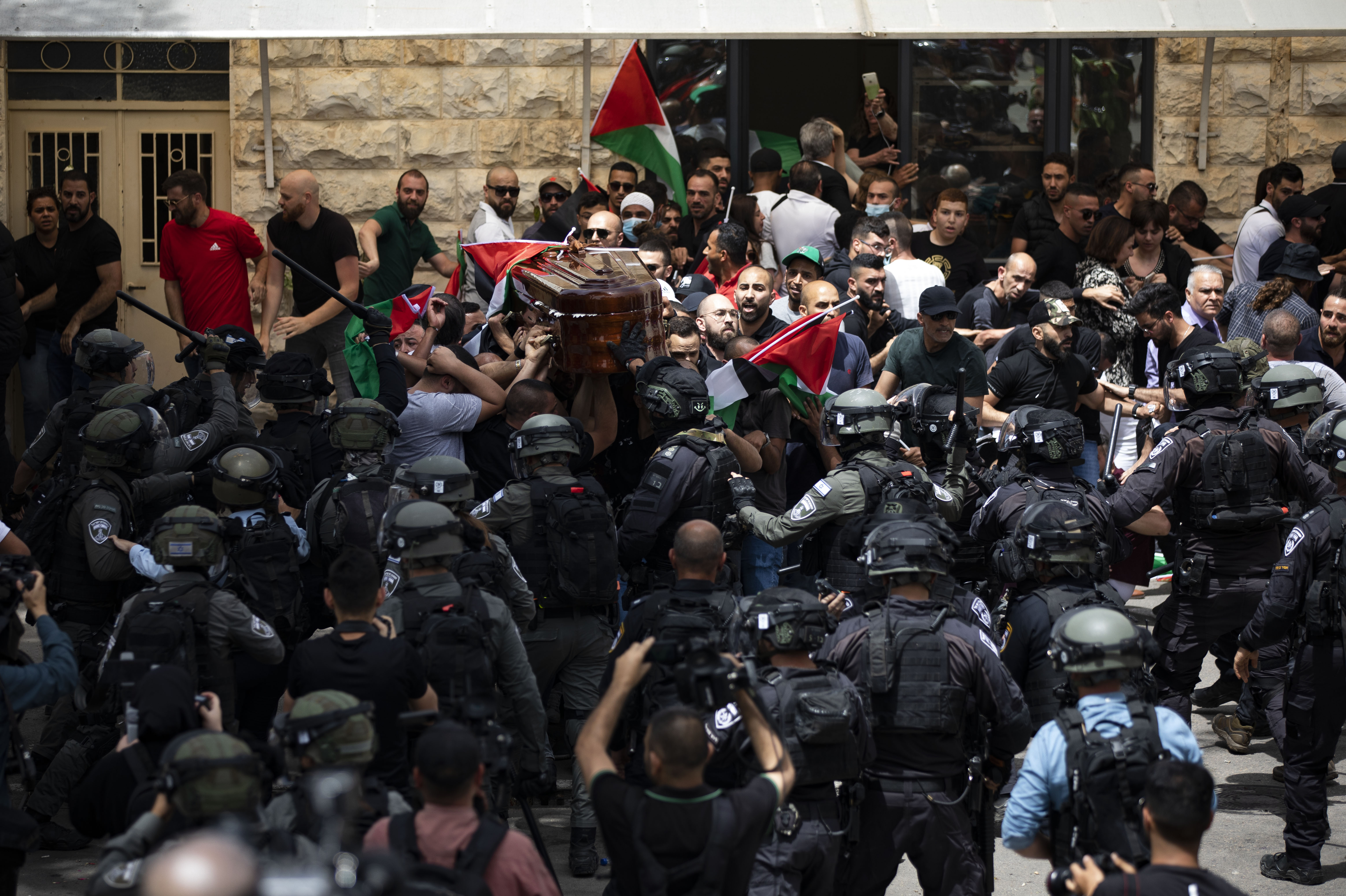 Palestine: Israeli police attack mourners carrying Abu Akleh’s body during funeral procession