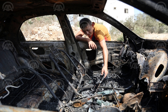 Palestine: Israeli settlers burn car & write racist graffiti