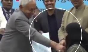 Outrage after Indian chief minister pulls woman’s niqab at public event